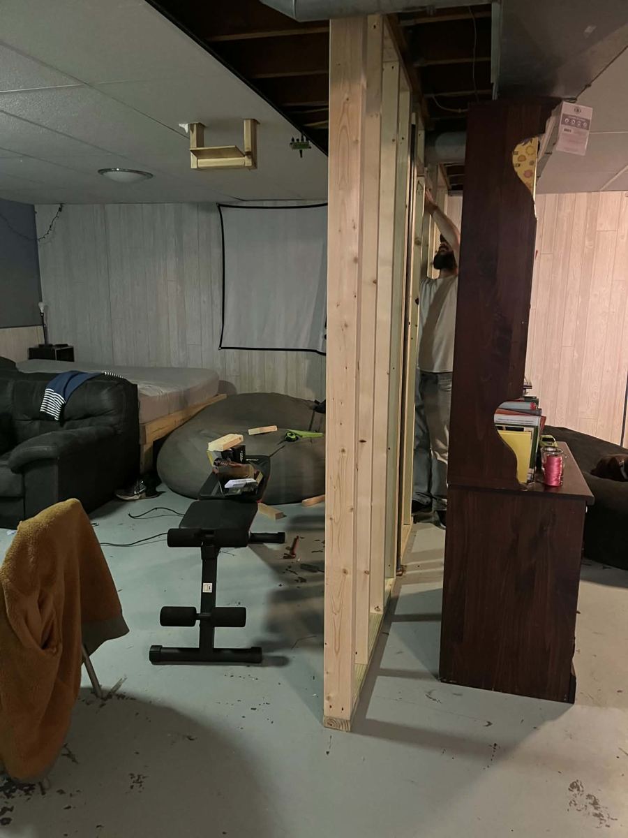 Basement family room before the remodel, ceiling opened up
