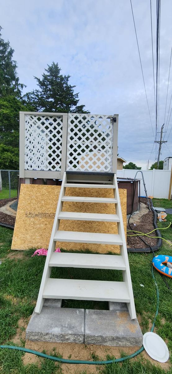 New exterior deck stairs with lattice skirting
