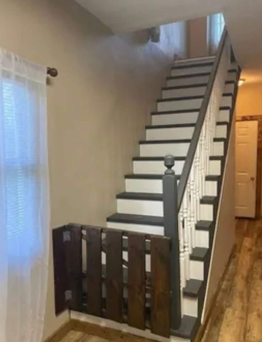 Refinished staircase with dark treads and white risers