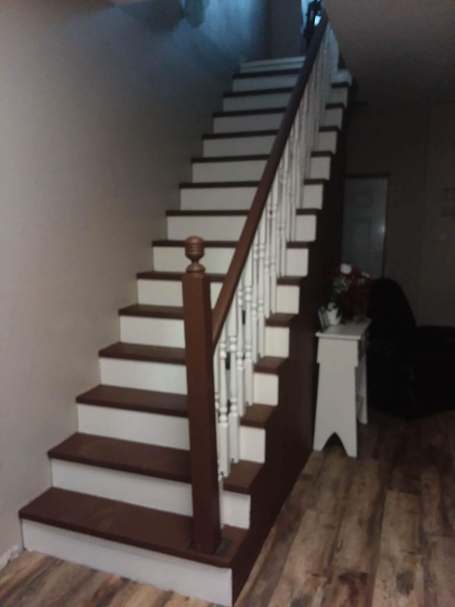 Refinished staircase with dark stained treads and white risers